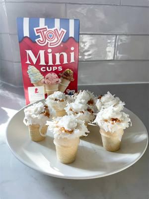 We guarantee you'll be the star of your holiday party if you bring these! 🍦☃️ Coconut & White Chocolate Mini Cones Recipe Ingredients: - Joy Mini Cups - 2 c melted white chocolate chips - 1 c shredded coconut - 6-8 crumbled cookies - 8 oz cream cheese, softened - 1 c powdered sugar - 1/4 c heavy cream - 1/2 tsp vanilla Directions: 1. Whip cream cheese until fluffy; mix in powdered sugar and vanilla. 2. Whip heavy cream to stiff peaks, then fold into cream cheese mix. Transfer to piping bag. 3. Dip cone tops in melted chocolate, then roll in coconut. 4. Add 2 tsp cookie crumbs to each cone, pipe in filling, sprinkle coconut, and serve! #JoyCone #BringJoyHome #IceCream #IceCreamCone #Recipe 