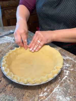 Recipe Below! ⬇️  The foundation of every good pie is the pie crust. If you’re looking for a good recipe, this is the one! It came from my mom and grandmother and is a classic. Flaky and delicious! 🥧 (Hopefully nobody will be triggered that I’m wearing rings in this video. Just making pie for my very own family. It’s ok! 😆) Pie Dough  Ingredients: 1/2 cup cold water 1 egg 1 Tbsp vinegar  1 tsp salt  1 1/2 cup shortening 3-4 cups flour  Directions: With a fork, whisk together the water, egg, vinegar, and salt in a mixing bowl. Add the shortening first and then 3 cups flour. Mix together well with a fork or pastry cutter and then finish working the dough with your hands till it forms a good ball. Add the 4th cup of flour as needed. Most of the time I only use about half of it. Don't over-mix the dough. Use the dough right away or store it in a ziplock bag in the fridge.  Yield: 3-4 single crusts #piecrust #pie #homemade #homebaker #dough #baking 