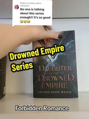 Cleopatra meets Fourth Wing in this romantic fantasy series with forbidden romance, political intrigue, and slow burn spice. Best of Booktok #1 in Historical Fantasy #1 Greek and Roman Myth and Legend Barnes and Noble Blog Top Five Indie Fave Lady Lyriana Batavia is third in line to the Seat of Power in Bamaria: a position of wealth and privilege, but not safety. Bamaria falls under the rule of the Lumerian Empire, survivors of a celestial war whose island sank in the Drowning. Now all Lumerians submit to the Emperor and his strict laws about magic. He decides what magic can be practiced and what powers remain forbidden. He decides who will die for possession of forbidden magic. Lyr’s own cousin was executed for wielding the wrong kind. And for years, Lyr has sworn to protect her older sisters, helping them conceal their own illicit magic. But when Lyr must participate in the ceremony that reveals her power, she uncovers something else entirely. Something that means banishment from the Empire. Faced with death in exile, and leaving her sisters behind, Lyr has no choice but to accept a deadly contract. She has seven months to train as a warrior and pass the Emperor’s brutal test of strength, without magic. But when she’s forced to train with Lord Rhyan Hart, the man she’s secretly loved since she was a girl—a feared warrior in exile himself, forbidden to her in every way—she’s in danger of losing far more than her family, life, and country. Rebel forces, and an invading army, are destabilizing Bamaria, just as her family’s secrets threaten to reveal themselves. Surviving the training, and saving her sisters may mean sacrificing her own heart. Daughter of the Drowned Empire is the first book in a sensational romantic series featuring a riches-to-rags heroine, dangerous court politics, and a forbidden slow-burn romance. Perfect for fans of Jennifer L. Armentrout, Danielle L. Jensen, and Rebecca Yarros. 'One fantastical world. One fierce heroine to take it down! Daughter of the Drowned Empire is sexy, thrilling, and pure magic!' Cecy Robson, author of Bloodguard DAUGHTER OF THE DROWNED EMPIRE by Frankie Mallis is a breathtaking and sumptuous fantasy romance that had me kicking my feet, gasping for air, and blushing from the first page to the last. Filled with intriguing court dynamics, the world feels completely fresh and immersive. Lyr is a flawed and lovable heroine you can't help but root for, giving vibes of a magical Cleopatra. One of my favourite reads of the year! ― Elizabeth Helen, author of Bonded by Thorns #bookish #bookboyfriendsdoitbetter #romanticfantasy #romanticfantasybooks #romantasy #romantasyreads #forbiddenromancebooks #slowburnromance #fantasybookrecs #bookrecs #romantasytok 