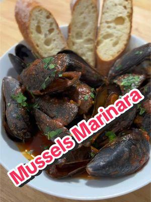 Feast of the Seven Fishes | Part 5 | Mussels Marinara  Something we love is good seafood, good red marinara ans fresh bread.  ~Recipe~ - Mussels - Shallot -3 Garlic Cloves - Marinara (Homemade or Jar works) - White Wine - Parslay - Bread for dipping - Take your mussels in place in water with salt. When ready to cook, make sure you debeard your mussels and clean the shells - In a pot, with EVOO. Cook Shallots and Garlic on Med Low Heta until nice and fragrant.  -Add in Dry White wine. Let cook 3-4minutes.  - Add in Red Sauce and stir to simmer - Dump in Mussels. Stir and place lid on top. Allow all the mussels to open up. Stir occasionally.  - Serve with fresh bread and parslay.  #feastofthesevenfishes #mussels #musselsmarinara #seafood #Recipe #fish #xmas #xmaseve #italian #dinner #CapCut 