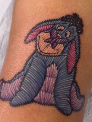 Its Eeyore from Winnie the Pooh! In embroidery style  tattoo #sanantoniotattooartist #SanAntonioTattooArtist #disneytattoo #embroiderytattoos #womantattoo 