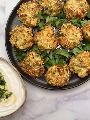 BAKED CAULIFLOWER LATKE!🕎 You know how much I love cauliflower, and Hanukkah is the perfect opportunity to try these baked cauliflower latkes.  These delicious cauliflower latkes are a must have on your holiday table - so easy to prepare and everyone will love it!😍 Follow @ruhamasfood for more!🤍 RECIPE BELOW 👇 . Recipe: Ingredients- 2 small cauliflowers, cut to florets  1 teaspoon of salt for the boiling water 6-7 cups of water to cover the cauliflower  1 Cottage cheese (5 Oz / 140 grams) 2 cups of shredded mozzarella cheese  Handful of chopped parsley  1 tablespoon of chopped dill 1 sliced scallion  1/4 cup of olive oil  2 eggs 1 teaspoon of salt  1/2 teaspoon of black pepper  1 teaspoon of garlic powder  1 teaspoon of Dijon mustard  3 tablespoons of all purpose flour  1 teaspoon of baking powder  For the topping- sesame seeds and olive oil spray  Method- 1. In a large pot put the cauliflower florets with salt and cover with water.  2. On medium heat boil the cauliflower florets for about 15-20 minutes until they start to soften. 3. Drain the cauliflower and place them in a bowl.  4. Using a potato masher, roughly mash the cauliflower so it’s still chunky.  5. Add the rest of the ingredients and mix it all well.  6. Using an ice cream scoop sprayed with olive oil, scoop from the mixture and place on a baking sheet with a parchment paper.  7. Using a tablespoon, gently flatten each of the latkes.  8. Sprinkle sesame seeds and spray with olive oil.  9. In a preheated oven on 420F/220C, bake the latkes for 20 minutes. 10. Transfer to convection broil on 450F for 7-8 minutes to get a nice golden color.  11. Place the latkes on a nice plate, garnish with fresh parsley leaves, and serve it with Greek yogurt.  Enjoy! Ruhama🤍 #hanukkah #latke #cauliflower #chanukah #fyp #baked #savory #fypage #ruhamasfood 