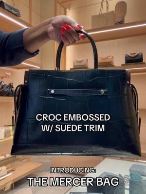 A full examination of our Mercer Satchel. The Large Mercer Croc-Embossed Satchel is softly deconstructed with layers of leather and rolled suede. Discreet hardware marks sleek zippered pockets inside and out. Carry it by the top handles or go hands-free with a removable crossbody strap. Video by @That Tory Girl at our Plano, Texas boutique. #satchel #satchelbag #womenshandbag 