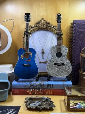 Another fun DIY project to share! ☺️💙 The mini guitar is from Axe Heaven. I bought it a year ago, but I believe it was just the Signature Black Miniature Acoustic Guitar. Before anyone asks, I’m NOT selling these. I’m just sharing my process in case someone wants to DIY their own. | #taylorswift #taylorswiftpin #swiftie #taylorswiftmerch #taylorswiftart #TSTheErasTour #swifttok #TaylorSwiftCollection #taylorswiftcollector #taylorswifteras #TSTTPD #TheTorturedPoetsDepartment #speaknow #lastkiss #guitars #guitarlove #musicpins #DIY #thefieldssupply 