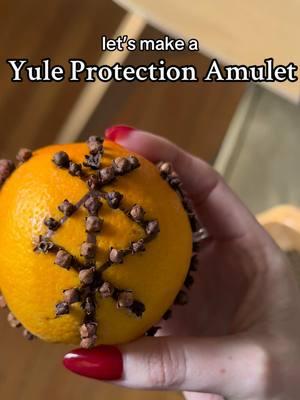 Save this to try later!  Yule Protection Amulet tutorial⚔️🍊 This is one of my fav festive spells to do this time of year! And it only calls for 2 ingredients 🤓 Oranges have long been used in spells for their vibrant energy, they are used to bring vitality, cleansing, and prosperity.  Cloves also play a powerful role in this spell as they are known for their protective energy (they’re literally spikes and will stab you if you’re not careful😅). Cloves are also wonderful for calling in strength, purification and clarity.  Yule Blessings to you  🎄♥️ #yule #protectionspell #protectionamulet #yuleseason #vvitchtokrising 