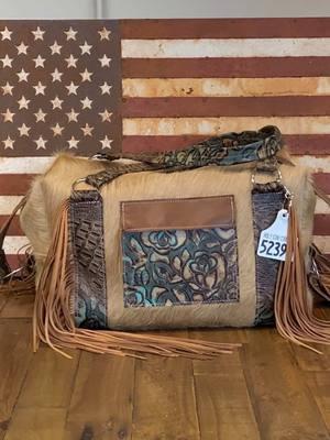 Travel necessities 🤠 #duffelbag #holycow #cowhide #leathercraft #oneofakind #westernfashion 