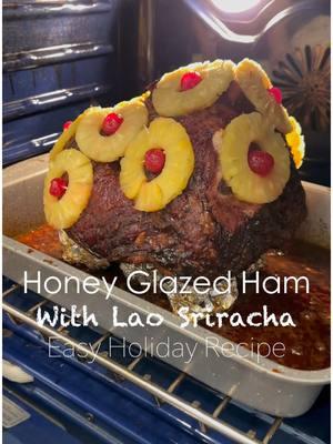 Lao Sriracha Honey Baked Ham Recipe by @davanh_spice  Just in time for Holidays 🎁🎄🎊🎉 Ingredients ** Glaze **  10 lbs bone-in ham ½ cup Lao Sriracha 2 cups granulated sugar 1 cup butter ½ honey 1 ½ tbsp. mustard 1 tsp. ground clove 1 tsp. ground cinnamon  1 garlic clove ** Decoration ** Sliced pineapple  1 jar maraschino cherries toothpicks You can prepare the glaze a day in advance. Store it in the refrigerator and warm it up before glazing the ham. Be sure to stir it regularly, as it can burn easily. If it starts to burn quickly, simply lower the heat. 1. Start by melting butter in pot on medium low heat 2. Stir constantly 3. Once butter is melted add sugar 4. When it turns into caramel add the rest of ingredients  5. Add honey stir it well then add Lao Sriracha, stir again 6. Now add the cloves ,cinnamon, garlic cloves and mustard Prepare the ham. Remove all the skin and leave some fat. Score the ham to diamond shape squares. Set that aside. Get the baking pan and fill the bottom with water. This will help the ham stay moist. Put a rack in the bottom of pan. Don’t let the ham hit the water.  Start by glazing the bottom of the ham, then place it on the rack and finish glazing the rest. Preheat your oven to 330°F. For a 10-pound ham, the cooking time is about 3 hours. Every 30-40 minutes, reglaze the ham and cover it again. Be sure to stop your timer while glazing to ensure the ham gets a full 3 hours of cooking time. During the last 30 minutes, add pineapples and cherries to the ham. Leave it uncovered to allow the surface to brown slightly. Thank you Sis @laomazing_eats @malybou for having us 🙌🏻🙏🏻 @davanh_spice Grab your Lao Sriracha on Southeastspice.com or Now Available on Amazon 🙌🏻🙏🏻🎊🎉🔥🌶️ Just in time for The Holidays 🎁🎄@Davanh  #laofood #laosriracha #sriracha #hotsauce #holidayham #EasyRecipe #southeastspice #laohotsauce 