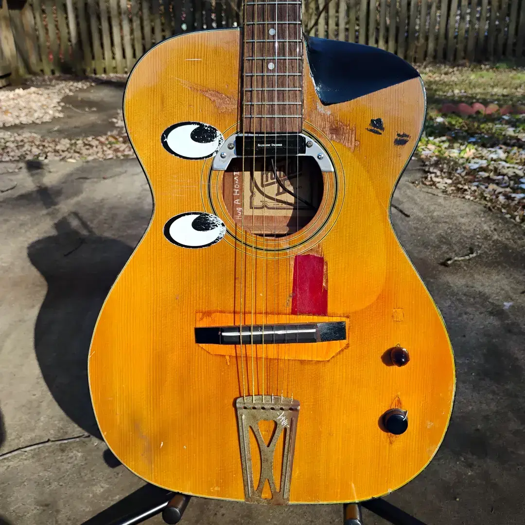 I got this guitar as a completely stock Hondo II when I first started learning to play. It had a lot of issues, but it was free and I needed an acoustic guitar to practice on. It wasn't long after that I began really experimenting with instrument making, and this became one of my main guitars to experiment on. It's had a lot of iterations over the years. I have played it for as long as 8 hours without interruption, I've written probably 40 songs on it, I've taken it all over the country as my beater guitar, I've used it for gigs and busking, I've had countless failures and mistakes while using it to learn luthiery, and it's become one of my favorite guitars that I've ever played.  #guitar #luthier #luthiery #hamsandwich #musician #musiciansoftiktok #ham #hondo #eyeball #hugahomie 