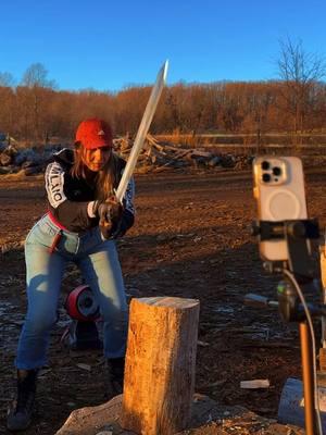 Splitting wood with a sword 🗡️ #choppingwood #creatorsearchinsights #asmrwood #satisfying 