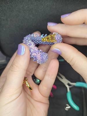 New dragon bracelet! . . . #jewelrymaking #beadweaving #beadwork#handcraftedjewelry #beadart #beadedartwork #beadedart #beadwork #brickstitch #peyotestitch #dragon #dragonart #dragonbracelet #dragonjewelry 