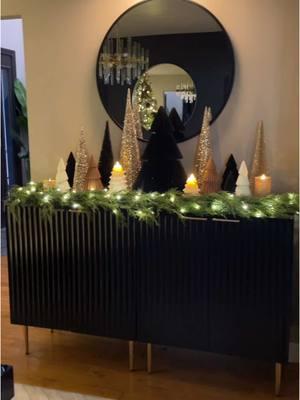 Check my linktree for link🔗 to these gorgeous candles 🕯️ I love a good tree forest 🌲. Mixing these different textured trees with my @Luminara Candles tree and glitter candles creates such a festive and cozy vibe.  #christmas #christmas2024 #christmasdecor #neutralchristmasdecor #minimalchristmas #christmasgreenery #minimalistchristmas  #neutraldecor #popofblack #popofbrown #brownblackdecor #softglamdecor #bolddecor #modernglam  #interiordesign #blackaccents #homedesign #glam #glamdecor #glamstyling #blackgolddecor #blackaccentwall #goldblackdecor #blackdecor #golddecor  #modernglam  #explorepage #openconcept #goldaccents #blackwall 