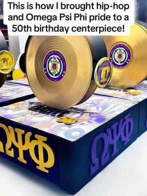 50th birthday centerpiece with hip-hop vibes and Omega Psi Phi pride—what do you think? #customcenterpieces #50thBirthdayParty #OmegaPsiPhi #HipHopDecor #MilestoneBirthday #BirthdayCelebration