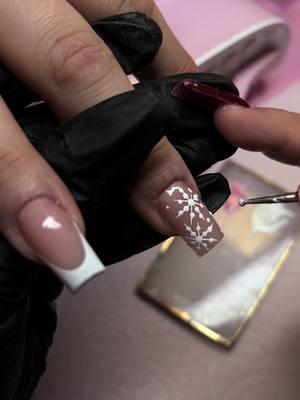 How to create a snowflake on nails.  #lovetheholidays #tiktokholidays #trend #fyp #chrismasvibes #foryou #fypシ゚viral #trendingvideo #nailsartvideos #nailsart #christmasart 