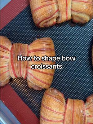 How I shape bow croissants, plus some tips for doing cross-lamination in a home kitchen: 	•	Be comfortable making regular yeasted, laminated doughs first (e.g., you can successfully laminate dough without butter melting or cracking). When you cut the dough during final rollout, you should be able to see clear layers of dough and butter  	•	Work quickly and keep your environment cold. Think about exactly what you’re going to do before you bring the dough out to work on. Chill the dough as needed   	•	Use a straight edge ruler and very sharp knife when cutting strips of dough  	•	Spray and brush the surface of the dough with water to help stick things together  #homebaker #pastrytok #croissanttok 