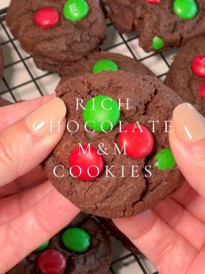 RICH CHOCOLATE M&M CHRISTMAS COOKIES 🎄 Baking ASMR version 👩‍🍳 These rich cookies are jam-packed with chocolate flavor and three types of morsels - and they always look SO pretty in my Christmas Cookie tins each and every year.  I included detailed instructions with this recipe in lieu of my voiceover - what do you think of this format? 🤔 You'll need these ingredients 💚 1 cup (226 g) unsalted butter, (2 sticks) room temperature 1 cup (200 g) granulated sugar 1 cup (200 g) light brown sugar, packed 2 large eggs 2 tsp vanilla extract 2 ½ cups (300 g) all-purpose flour , (stir, spoon, & level) ¾ cup (60 g) cocoa powder, (I use Hershey's Special Dark Cocoa) 1 tsp baking soda ½ tsp salt ½ cup (170 g) semi-sweet chocolate chips ½ cup (170 g) dark chocolate chips 1 cup (170 g) Holiday M&M’s, divided  Instructions ❤️ 1. Preheat oven to 350º 2. Cream butter, sugars until fluffy. Add in eggs and vanilla. Mix and combine. 3. In separate bowl, whisk together the flour, cocoa, baking soda and salt. Add slowly to wet ingredients until dough forms. 4. Add chocolate chips and 1/2 cup M&Ms. Mix until just combined. 5. Scoop dough using #40 scoop and place onto baking sheet. Add a few more M&Ms to the tops of each cookie. 6. Bake 10-11 minutes, until just set. Let cool on cookie sheet 3-5 minuets before transferring to cooling sheet.  Original recipe credit dessertnowdinnerlater (dot) com and 🔗 in my eye gee stories 🍪 #chocolatecookies #chocolatemmcookies #christmascookies #christmascookies #christmascookie #cookietins #christmascookierecipe #cookierecipe #holidaycookies #cookiesoftiktok #bakingasmr #asmrbaking #asmr 