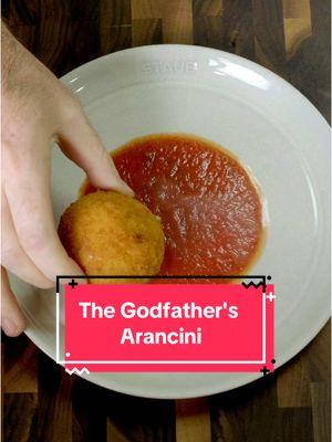 If you didn’t get the reference at the end of the video, you gotta watch (or rewatch) The Godfather Part II #ad Or better yet, in honor of The Godfather Part II celebrating 50 years, get The Godfather Trilogy in 4k and watch the whole thing while enjoying these Arancini. @Paramount Pictures  These Sicilian Arancini are a classic street food, and they are meant to be eaten hot. Maybe if Don Fanucci had eaten some more of these instead of oranges, then Don Corleone wouldn’t have needed to take care of him for the neighborhood. Recipe For 10 Arancini For the rice: 	Olive Oil 	•	1 Shallot (Minced) 	•	1 lb Arborio Rice 	1 Pinch Saffron 	•	1 qt Chicken Stock 	4 Tbsp Butter 	•	1 Cup Parmesan (Freshly Grated) 	•	 For the filling: ½ lb Ground Beef ¼ Onion Diced ½ Carrot Diced 1 Celery Stalk Diced 2 Cloves Garlic (Optional and Minced) 	•	2 Tbsp Tomato Paste 	•	½ Cup Tomato Purée 	•	½ Cup Frozen Peas 	•	Salt & Pepper to Taste 	•	 For assembly: 	•	½ Cup Shredded Mozzarella 	•	1 Cup Flour 	•	2 Cups Water 	•	2 Cups Breadcrumbs 	1 Qt Oil  -On low, heat the shallot in a splash of olive oil until translucent. Then add the rice and toast for 2 minutes. -Add the saffron water and chicken stock, and let simmer for 12-15 minutes. -Turn off the heat, and add the butter and parmesan. Mix until combined and then spread the risotto out of a sheet pan to cool completely. -Brown the ground beef in a bit of olive oil before adding the soffritto of onions, carrot, and celery. -As an option, I like adding garlic, but some Sicilians may not like that. Choose a side and never look back. -Add the tomato paste and cook for 2 minutes before adding the tomato puree. -Finish with the frozen peas, salt, and pepper to taste. -To build the arancini, wet your hands and scoop a full palmful of risotto into your hand. Build a small well, and place a Tbsp of the filling into it with some pieces of mozzarella cheese. -Place these balls in the fridge for about 30 minutes - 1 hour before moving on. -For the coating, combine the flour and water into a shallow bowl. Cover the rice balls in this light batter before fully coating in breadcrumbs. -Fry at 375F - 190C for about 2-3 minutes, or until golden brown. #TheGodfatherPart2 #italianfood #arancini #cooking