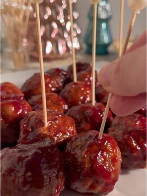 Saucy Cranberry Mini Meatballs - the perfect holiday appetizer! Ingredients: (Makes about 20 mini meatballs) For the meatballs: - 1 lb ground beef - 1 egg - 1/2 cup seasoned Italian breadcrumbs - 2 garlic cloves, minced - 1 tbsp tomato paste - 1/4 tsp garlic powder - 1/4 tsp onion powder - 1/4 tsp pepper - 1/1 tsp Italian seasoning - 1/2 tsp salt For the sauce: - 1/2 cup of cranberry sauce (If you need a good homemade cranberry sauce recipe, you can find it on my page) - 1/3 cup BBQ sauce - 3 tbsp low-sodium soy sauce  - Black pepper, to taste Directions: 1. In a bowl, combine: ground beef, 1 egg, Italian breadcrumbs, crushed garlic, tomato paste, and seasonings. Mix thoroughly and form into 20 mini meatballs. 2. Place meatballs on a baking sheet with a drizzle of olive oil and cook on 400º for 15 minutes, or until the meatballs reach 160ºF internally. 3. While the meatballs are cooking, combine: cranberry sauce, BBQ sauce, and soy sauce in a pot. Bring to a low boil and stir well.  4. When the meatballs are fully cooked, coat them in the sauce. Enjoy! #holidayappetizer #christmasappetizer #holidayrecipes 