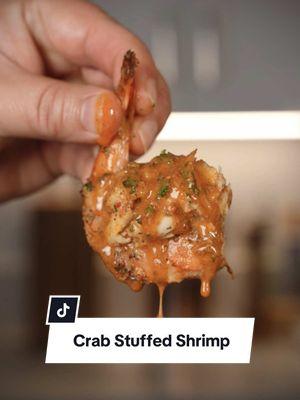 Crab Cake Stuffed Shrimp 🦀🍤 Recipe ⤵️⤵️⤵️ Recipe Makes 34  For the Crab Cake Stuffed Shrimp: 34 Shrimp ~13-15 per pound 1 lb Lump Crab Meat 6 Tbsp Cajon Seasoning 3 Eggs 1/3 Cup Mayo 1 Tbsp Salt 2 Tbsp Dijon 1/4 Cup Chopped Parsley 1 Sleeve Crushed Ritz Crackers 1/2 Red Bell Pepper 1 Lemon How to in my @Weber Grills SearWood: 1. Clean Shrimp and Season with 4 Tbsp Cajon seasoning 2. In a Bowl whisk eggs first, then add Mayo, 2 Tbsp Cajon seasoning, Salt, Dijon, Parsley, and whisk all together  3.  Add Mixture over Crab, and add crushed Ritz Crackers, Bell Pepper, and fold in ingredients  4. Form little balls and place in the center of the shrimp 5. Add to a skillet and squeeze Lemon on top 6. Set Weber SearWood to 450 degrees and cook until Shrimp and Crab read 145 degrees (Approximately 12-15 min) For the Cowboy Butter:  12 ounces Butter  1/2 Lemon  1 Tbsp Minced Garlic  1 Tbsp Lemon Zest  1 Tbsp Dijon Mustard 2 Tbsp Paprika  1 Tsp Cayenne 2 Tbsp Parsley  1 Tbsp Chives 1 Tbsp Red Pepper Flakes  How to on my Weber Slate: 1.  In a pan on low heat add Butter, Lemon Juice, Garlic, Lemon Zest, Dijon, Paprika, Cayenne, and whisk until it forms a sauce. (Do not let it break) 2. Turn off the heat and add Parsley, Chives, and Red Pepper Flakes. Mix until well incorporated.  Pro tip: If the sauce breaks, add in the fridge to cool. You will be able to make it thicken and turn back into a sauce!  #crab #cake #stuffed #shrimp #Recipe #holiday #ideas #weberpartner #weber 