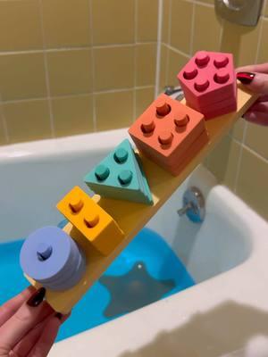 Here is why we are loving the Splash, Stack, and Sort Bath Toy: 💧 20 colorful foam pieces that float and stick to tub walls. 🎨 Match, stack, and sort shapes for endless fun and learning. 🔗 Suction-cup sorting board for easy, secure play. SAVE for later and SHARE with someone who would love this! #babytoys #toddlertoys #toddlermom #watertoys #babyproducts #MomsofTikTok 