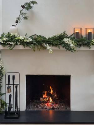 Decorating my fireplace mantel for the holidays with one of my favorite touches—fresh flowers!  This time, I’m adding orchids to the garland for a simple yet elegant look. I’ll change them weekly to keep it fresh. To finish, I add candles and hurricanes for that warm glow. These little touches bring so much beauty to my home this season.  #StudioBKM #HolidayDecor #Orchids #CandleGlow #MantelDecor #FreshFlowers