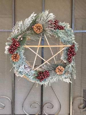 Enhanced my previous wreath that I made because it got beat up by the weather last year. #wreath #christmaswreath #yule #yulewreath #wintersolstice #pagan #witch #fyp #trending #DIY #diywreath #dollarstorecrafts #wintercrafts #crafts  