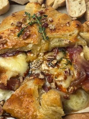 Baked Brie is one of the best Christmas appetizers and it couldn’t be any easier 🥰🧀 #easyappetizers #bakedbrie #christmasrecipes #christmasappetizer #holidayrecipes #fyp #yummy  Baked Brie: 8-12 oz Brie cheese wheel 2 tbsp honey 2 tbsp fig jam Pepper 1 tbsp fresh thyme leaves 1 sheet frozen puff pastry, thawed 8 slices of prosciutto 1 egg, beaten  Course sugar for sprinkling (optional) 1.) Preheat oven to 425F. Lay parchment paper on baking sheet followed by thawed puff pastry and cheese. 2.) Cut Brie in a crosshatch pattern. Spread fig jam over Brie followed by honey, pepper & thyme then wrapping with prosciutto. 2.) Fold corners of pastry over cheese, brush with beaten egg then sprinkle with optional course sugar. 3.) Bake approximately 25 minutes or until pastry is a deep golden brown. Enjoy with crackers and/or bread! 