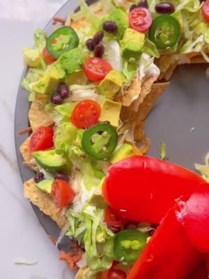 Let’s make the VIRAL NACHO WREATH using @MiNinaTortilla Organic Sea Salt tortilla chips! #Ad These organic white corn chips, perfectly tossed in sea salt, are the foundation for this festive and flavorful snack.  Here’s what you’ll need: * Mi Niña Organic “Sea Salt” White Corn Tortilla Chips * Shredded cheddar cheese * Sour cream * Shredded lettuce * Grape tomatoes (sliced in half) * Avocado (diced) * Black beans * Jalapeño (sliced) * Red pepper (for the bow) How to make: 1️⃣ Preheat your oven to 350°F. 2️⃣ On a sheet pan (round works great), place a small oven-safe bowl in the center. 3️⃣ Layer Mi Niña chips around the bowl, add cheese, and repeat for a second layer. 4️⃣ Bake for 7 minutes—the melted cheese acts as “glue” to hold everything together. 5️⃣ Spread sour cream on top as another “glue.” 6️⃣ Add shredded lettuce, diced avocado, sliced grape tomatoes, black beans, and sliced jalapeños. 7️⃣ For the finishing touch, create a festive bow using red pepper slices!  Shop Mi Niña Organic “Sea Salt” Tortilla Chips online or at your local grocer. #mininapartner #charcuterieandthings #foodstyling#MiNiñaTortillaChips #NachoWreath #HolidaySnacks #OrganicChips #christmasrecipes #nachorecipes