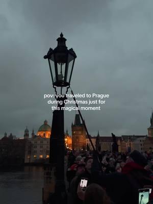 The Prague Lantern Lighting is a magical Advent tradition that brings warmth and light to the city’s wintery streets.  Held during the festive season, this event involves the ceremonial lighting of lanterns in various parts of Prague, symbolizing hope and togetherness. Locals and visitors gather to enjoy the glow of handcrafted lanterns, accompanied by carol singing and performances. Here’s all you need to know ⬇️ A lamplighter in historical attire illuminates the bridge’s gas lamps by hand. This event occurs daily from December 1 to December 23, starting around 4:05 p.m. and concluding by 5:00 p.m., aligning with dusk in Prague. The lamplighter begins at Křížovnické Square near the Church of St. Francis of Assisi, lighting 46 gas lamps along both sides of the bridge #christmas #prague #travel #traveltok #fairytale 