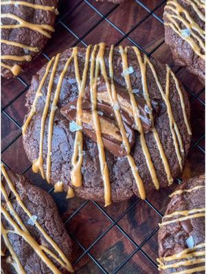 Reese’s Brownie Cookies  If you have a box of brownie mix lying around, you’re in for a treat!  I absolutely love making brownie cookies from a box mix. They’re so easy and delicious! Today, I decided to switch things up and added some Reese’s chocolate bars to the mix and a drizzle of creamy peanut butter on top once out of the oven. The combination of fudgy brownie texture with the creamy peanut butter flavor is simply irresistible.  —Ingredients— 1 box of brownie mix  2 eggs  1/3 cup flour  1/2 cup oil  1 cup dark chocolate chips (or semi sweet) 2 Reese’s chocolate peanut butter bars 7.37oz each (chop one for inside the batter and chop the other to place pieces on top of each cookie before baking)  1/2 cup of creamy peanut butter  Flaky salt (optional) 1. Preheat the oven to 350°F. Line a baking sheet with parchment paper.  2. Crack two eggs in a large bowl, add in oil and mix well.  3. Add in the brownie mix and flour and mix until well combined.  4. Chop one of the Reese’s chocolate bar into bite size pieces and fold into the batter along with 1 cup of chocolate chips.  5. Use a 2 tablespoon cookie scoop to create cookie dough balls (This mixture should make you about 18 cookies). 6. Place them about 2 inches apart on the baking sheet. Chop the second Reese’s bar and place 2 pieces on top of each cookie. Bake in the preheated oven for 8-9 minutes. 7. Remove from the oven and let the cookies cool in the tray for about 5-10 minutes before transferring them to a cooling rack. 8. Microwave the peanut butter for 30 seconds this will make it easier to drizzle. Drizzle over the cooled cookies and sprinkle some flaky salt on top. Allow peanut butter to set for about 10 minutes before enjoy.  #cookieseason #reeses #cookie #reesesbrowniecookies #peanutbutterlover #dream #EasyRecipe #vibes #cozy 