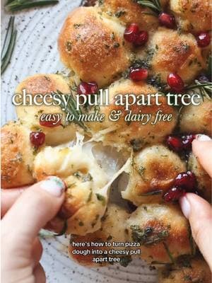 https://plantifullybasedblog.com/2024/12/20/easy-vegan-christmas-tree-pull-apart-bread/ * 12 ounces pizza dough * ¾ cup vegan mozzarella shreds * 2 tablespoons vegan butter, melted * 1 teaspoon garlic powder * 1 teaspoon dried parsley * ¼ teaspoon salt * ¼ cup pomegranate seeds, as garnish * Few sprigs of rosemary as garnish #cheesybread #pullapart #christmas 