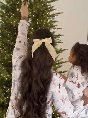 New tradition unlocked for years to come 🎄✨ How cute does @Ashley Bejarano and her fam look in these matching PJs? 🥰  #matchingpajamas #christmastraditions #christmastreedecorating #christmaspajamas #bows #redribbon #patpat 