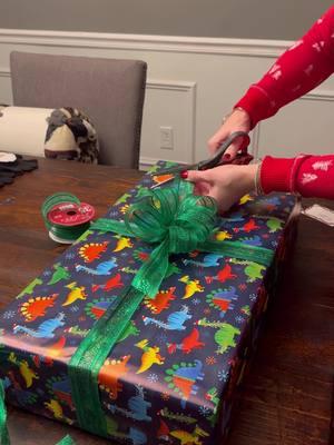 Part of me thinks wrapping is therapeutic but dang it takes too long. 😂  #christmas #christmasgift #giftideas #giftwrapping #giftwrappinghacks #christmasbows #crafty #craftymoms #fyp 