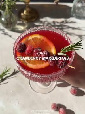 Anyone else trying to squeeze all of the Christmas cheer into this weekend?! I’ll be baking, making Spiced Cranberry Margaritas, and watching The Holiday if you need me 🫡  Serves 8 Ingredients: 1 1/2 cups silver tequila or vodka 1/2 cup Cointreau or Grand Mariner 1 1/2 cups cranberry juice (or use cranberry cocktail for a sweeter drink) 1 cup orange juice 1/2 cup lime juice 1 cup Spiced Cranberry Syrup (recipe below) @harmonyblends citrus finishing salt for the rim Sugared cranberries, rosemary sprigs and orange slices to garnish SPICED CRANBERRY SYRUP: 1 cup water 1 cup sugar or honey 1 cup fresh or frozen cranberries 2 inch piece fresh ginger, peeled 1/2 teaspoon cinnamon Zest from 1 large orange Instructions: In a sauce pan over medium heat, bring the water, sugar, cranberries, ginger, cinnamon and orange zest to a light boil. Once the cranberries have popped and sugar has dissolved, remove from heat and let it steep for at least 30 minutes. Strain and set aside. It should yield about 1 cup. In a pitcher, combine the tequila, Cointreau or Grand Mariner, cranberry juice, orange juice, lime juice, and spiced cranberry syrup. Pour over ice, rim with salt, and garnish to serve. #broccyourbody #EasyRecipes #festivecocktails #cocktails #cranberrymargarita