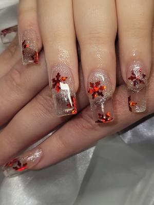 How cute are these?! #winternails #winternailideas #redsnowflakes #icenails #clearacrylic #snowflakenails #snowflakes 