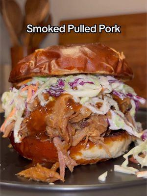 Smoked Pulled Pork 🐷💨🔥 #ad Pulled Pork is one of my favorite easy delicious ways to feed a crowd during the holidays. This cooking method is fool proof and delivers tender, juicy amazing results! Head over to the link in my bio to find where you can buy Prairie Fresh USA Prime®️ pork near you!🐷 FULL RECIPE ⬇️ INGREDIENTS  - 1 @Prairie Fresh Pork USA Prime®️ Pork Shoulder Butt - Yellow Mustard  - BBQ Rub of choice  - 5-6 tbsp butter (cut into pats) - 2-3 tbsp brown sugar  - 2-3 tbsp honey  Coleslaw: (Combine all ingredients then place in the fridge until ready to serve)  - 12 oz bag of coleslaw mix  - 2/3 cup avocado mayo  - 1-2 tbsp apple cider vinegar  - 2-3 tbsp of honey - Salt & pepper to taste Note(s): Measurements are estimated. Adjust ingredients to your personal preference.  DIRECTIONS  1. Pat all sides of the pork dry with a paper towel then coat all sides with a thin layer of yellow mustard for a binder. From there, season generously with BBQ Rub on all sides. Make sure to pat it into the meat. 2. Place the pork on the smoker at 205°F before you go to bed and let it roll overnight. (10-12 hours) 3. Check it in the morning, and let it continue smoking until till it reaches around ~165° internal and has developed a nice bark. Once it's there, place it in a large pan. Place the pats of butter on top, sprinkle on the brown sugar and drizzle on the honey.  4. Cover tightly with foil then place back on the smoker at 250°F. Let cook until the pork reach around 205°F internal and is probe tender. (2-4 hours)  5. Let it rest in the oven for at least 1.5-2 hours  before shredding. Alls that's left to do from there is ENJOY! 🙌🏻 • • • • #explore #cooking #bhfyp #food #EasyRecipe #simple #foodporn #tasty  #calwillcookit #diet #dinner #bbq #tasty #reels #grilling #healthylifestyle #gains #bbq #delicious #prairiefresh #pulledpork #holidays 