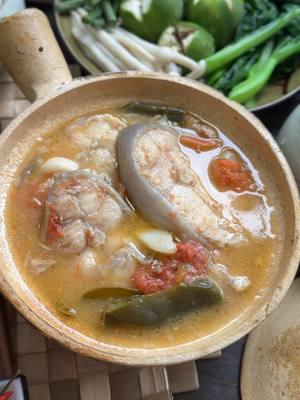 This is Kaw Prahok,a Cambodian slow stewed Catfish with Prahok, tomatoes, kaffir lime leaves, and lemongrass. If you like prahok, this is on my top of my list of recommended Khmer food. It’s not well known because it was introduced in Battambang, Cambodia, just several years before the war. How did I know? It was a dish originally created by my late grandfather-in-law back in his days before the war. He said that no one knew what it was but everyone loved it and copied this dish soon after. It is a deeply flavorful and aromatic dish eaten with fresh and steamed vegetables. This version is a variation that his wife, my late grandmother-in-law passed down to me. Thank you so much, grandma!! We miss and think of you dearly.  You can find the full recipe on my website-link in bio! #kawprahok #khmerfood #catfishrecipe #fish #cambodianfood  #fishrecipe #seafood #pork #foodstagram #lemongrass #prahok #fermentedfish #fishpaste #authenticfood #stew 