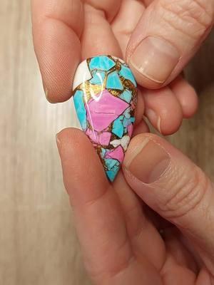 This pendant is absolutely stunning. The stone is an artisan cut Pink Dahlia Turquoise. It was cut by @stoneworkcreations .  It is set in chunky 18g 14k gold fill wire. The leaves and beads are 14k Goldfill. Pendant Measurements: width: 1 1/4 Inch; Pendant height: 3 1/2 Inches #wirewrappedpendant #statementjewelry #jewelryartist #jewellerydesigner #fashionstatement 