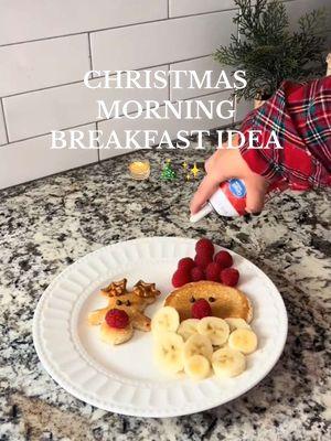 Christmas breakfast idea for kids that is sure to make the morning extra special ✨❤️   Grab your pancake mix, fruit, whip cream and a gingerbread cookie cutter for a fun breakfast your littles are sure to love! 🥹 Pretzles or bacon make great antlers!  #reindeerpancakes #santapancakes #christmasmorning #christmasrecipe #christmasbreakfast #pinterestmom #toddlerbreakfast 