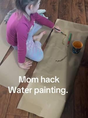 A little water and some paper. Works well with the brown packing paper or construction paper. No mess. She has a blast and I get let her “paint”. #hack #momhacks #kidfun #waterpainting #toddleractivities #nomessfun #momlife #cute 