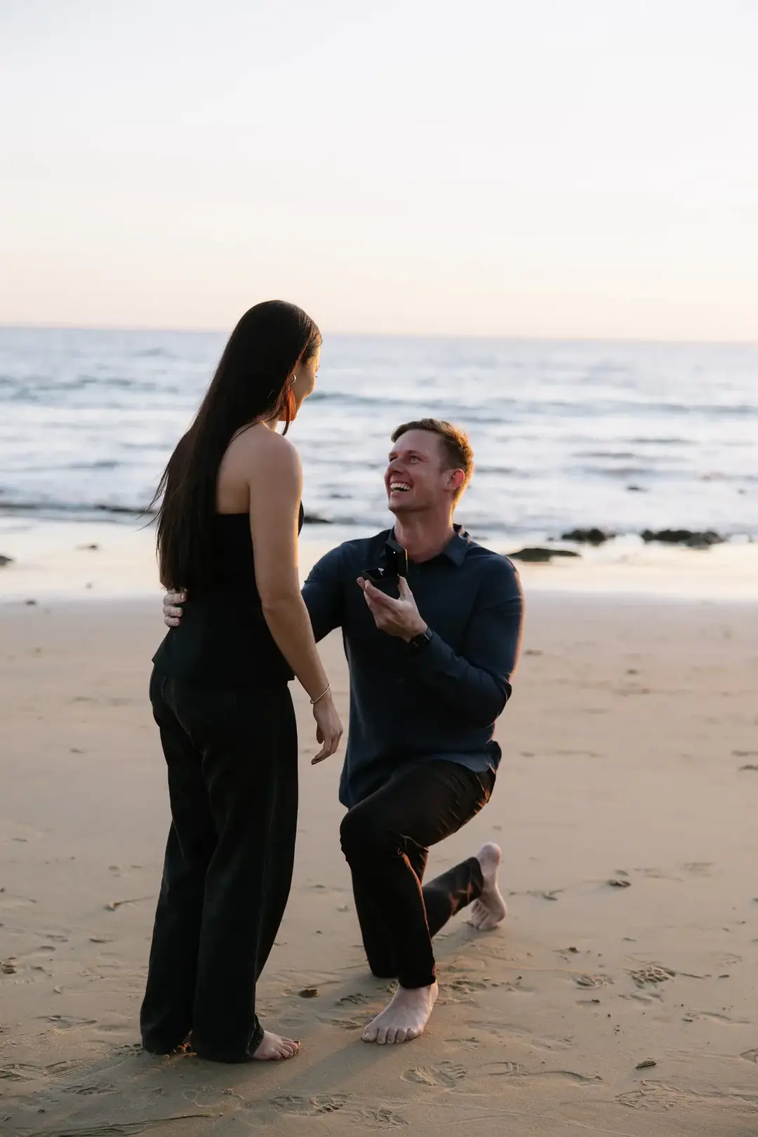 i get to marry you 🥹 #engagement #proposal #crystalcove #lagunabeach #engagmentring #engagmentphotoshoot #engagmentphotos #ring #engagmentring #ovaldiamond #ovalengagementring 