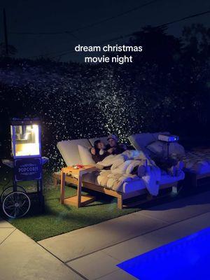 is this a dream?!?🥹 the perfect christmas movie night in our yard cozied up on our new @Castlery US lounge chairs, hotcoco in hand and snow falling from the sky!! Are you kidding?! 🤍✨  #movienight #athomewithcastlery #christmasmovies #holidaymovies #holidaycountdown #backyardvibes #snow #holidaytiktok #datenight #dateidea #datenightideas #backyardrenovation #homedecor #backyardinspiration 