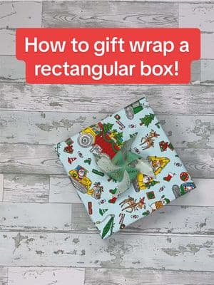 Replying to @Lillian How to gift wrap a rectangular box! #giftwrapping #wrappinghacks 