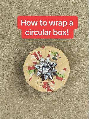 Replying to @Denedraa 🍃 How to wrap a circular box! #wrappingpresents #giftwrapping 