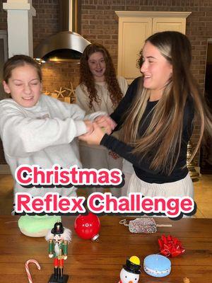 Christmas reflex challenge! They are so serious about this game!! #familygamenight #christmasgames #holidaygames #familyfun #reflexchallenge 