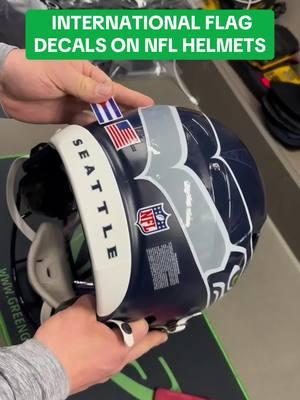 BTS in the equipment room: Flag Decals 🌍 #nfl #seahawks #international #helmet #equipment #bts 