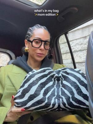 what’s in my bag ✨ mom edition. the Bottega Zebra pouch fits soooo much!! #bottegavenetabag #zebrabag #whatsinmybag #elisajohnsonsunnies #meshkiearrings #alignestellacoat 