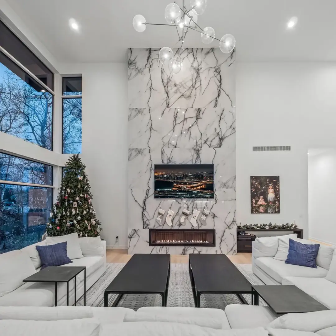 Imagine waking up Christmas morning in this stunning home This cozy living room is decorated for the season, hopefully Santa can fit through the fireplace! #luxuryliving #luxuryhomes #christmas #homedesign #architect #christmas2024 #architecture #azdarchitects