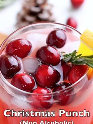 This Non Alcoholic Christmas punch is an easy and delicious holiday drink that takes just 5 minutes to make and is a crowd-pleaser recipe. It is refreshing, pretty, and festive, garnished with cranberries, oranges, lemons, and rosemary. #christmaspunch #christmasdrink  #christmasdrinks #holidaydrinks #creatorsearchinsights #christmas #partydrink #drinkideas #mocktail #christmasmocktail 