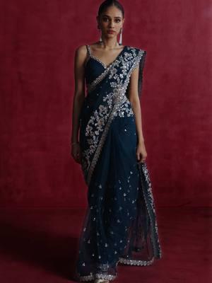 Our best selling Teal Blue Embroidered Net Saree is crafted on soft net and embellished with sequins. #indianoutfit #saree #lashkaraa 