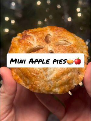 Merry Christmas Eve!!            Mini apple pie recipe🍎🥧::: For the crust:  - Pinch of salt - 2.5 cups all purpose flour (302 grams) - 1 cup cold butter (227g) - 6 tablespoons ice water (90 g) For the filling: - 2 tablespoons butter unsalted - 1 Granny Smith apple - 1 honey crisp apple - 2 tablespoons granulated sugar - 3 tablespoons brown sugar - 1/2 tsp cinnamon - 1/4 tsp all spice - 1/4 tsp ground cloves - 1/2 tsp nutmeg - 1 tablespoon lemon juice - 1-1 1/2 tablespoons all purpose flour Extras: Egg wash (1 egg whisked) Cinnamon sugar  Directions: 1. Mix together flour and salt 2. Add COLD butter and cut the butter into the flour. The preferred method is using a pastry cutter. Do not use your hands. The goal is to keep it very very cold, using your hands will introduce your body heat, we don’t need that.  3. When the butter and flour are cut together enough and look like a coarse flour, slowly add ice water in and fold in until it is just wet enough to press into a dough ball 4. Press into dough ball, divide it if you want to 5. Wrap in Saran Wrap and put in fridge for 3-6 hours, or overnight 6. Start on filling 7. Dice apples into small pieces 8. Add butter to pot on medium low heat, let it melt 9. Add apples and stir in for 3-4 minutes 10. Add seasonings and stir in for an additional 2 minutes 11. Turn off heat and quickly add flour 12. Stir in flour, the mixture should thicken almost immediately 13. Put mixture in the fridge to cool 14. When dough is chilled, flour a surface and roll out dough 15. Cut out circles, an even amount, one for the top and one for the bottom 16. Put the bottom part on a baking sheet with parchment paper, add filling, and place the top part on top 17. Close with fork around the edges 18. Cut at least 1 line in the top for pressure escape, or do a design 19. Brush with egg wash 20. Sprinkle with cinnamon sugar 21. Bake at 420°F for 12-15 min or until golden brown #Recipe #winterdessert #winterrecipe #falldessert #fallrecipe #christmasrecipe #christmas#CapCut 